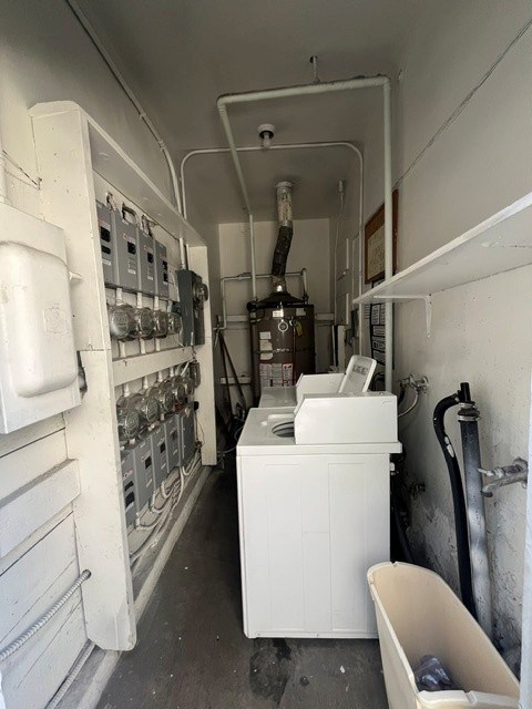 A white bathroom with a toilet and sink.