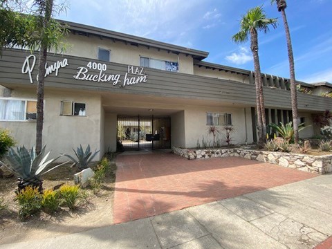 The image shows the front of a building named "Pampas Bucking Ham" with a clear blue sky in the background.