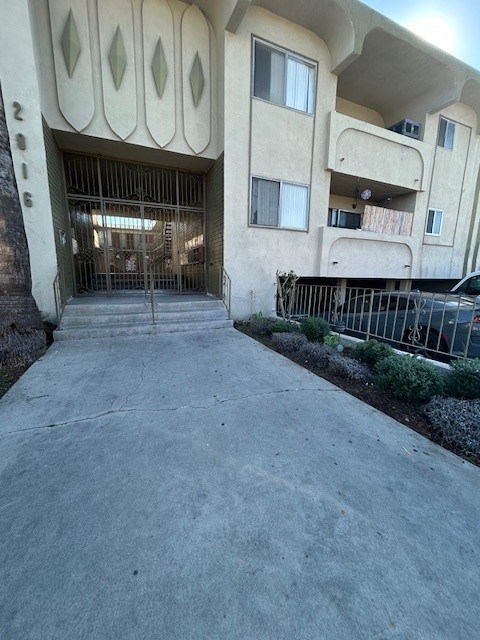 A building with a large gate in front of it.