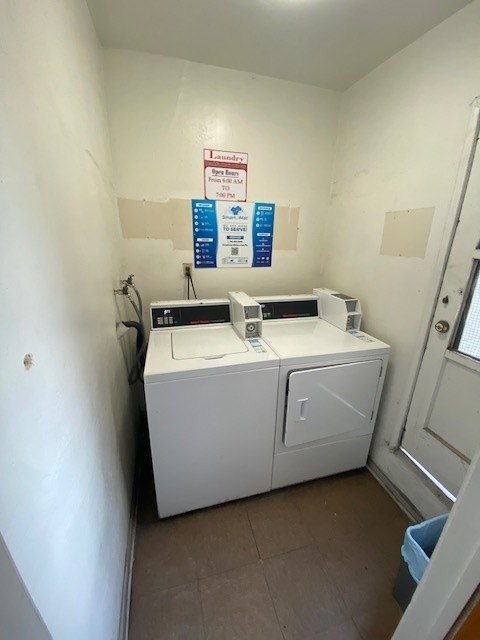 A small laundry room with a washer and dryer.