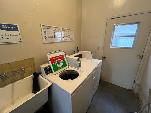A laundry room with a washer and dryer.