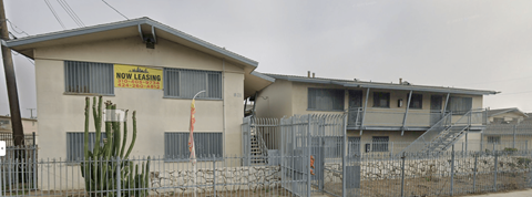 A house with a sign that says "Now Leasing".