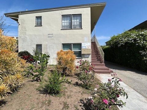 A house with a garden in front.