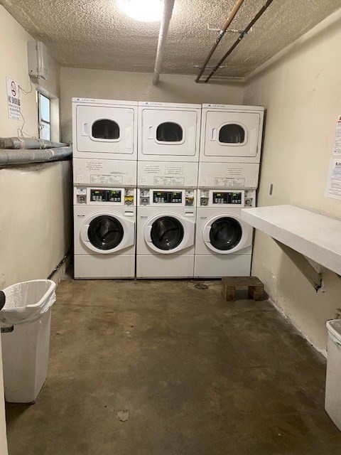 A row of washing machines in a laundry room.