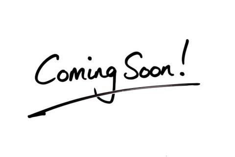 A handwritten sign that says "Coming Soon!".