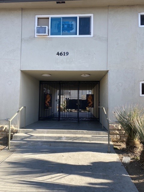 The image shows the front of a building with the number 4619 on it.