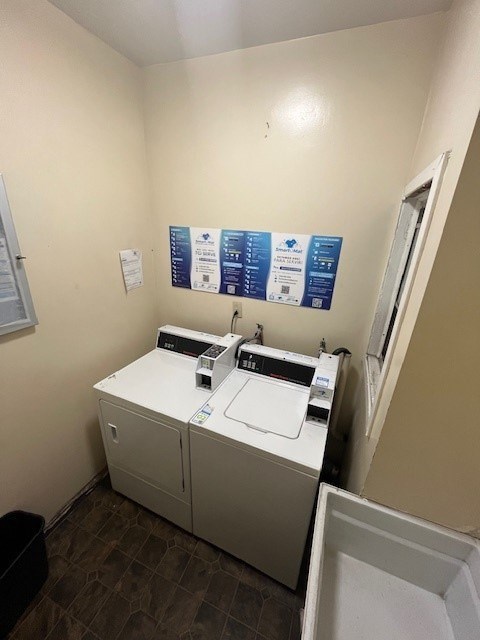 A small room with a washing machine and a dryer.
