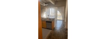A kitchen with a fan and a countertop.