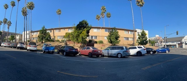 Cars are parked on the side of the road.