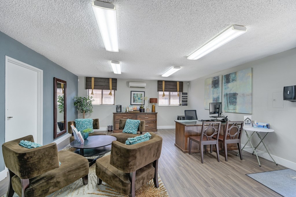 Asbury Place Apartments leasing office with lounge chairs and management desks 