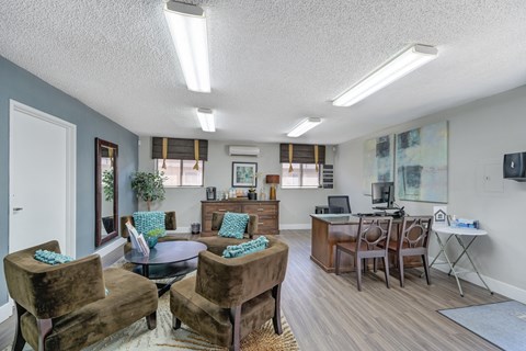 Asbury Place Apartments leasing office with lounge chairs and management desks