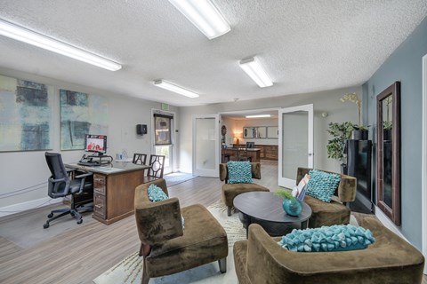Asbury Place Apartments leasing office with lounge chairs and management desks