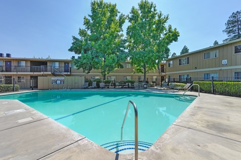 Asbury Place Apartments swimming pool area with lounge seating.