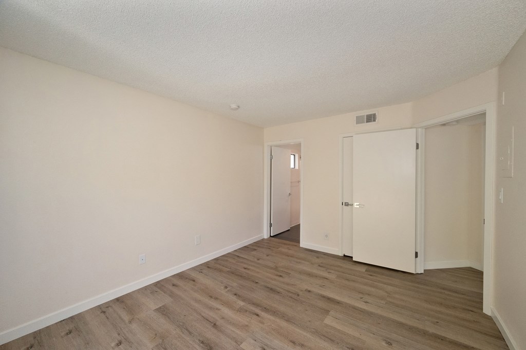 Apartment home bedroom with closet at Croft Plaza Apartments, California