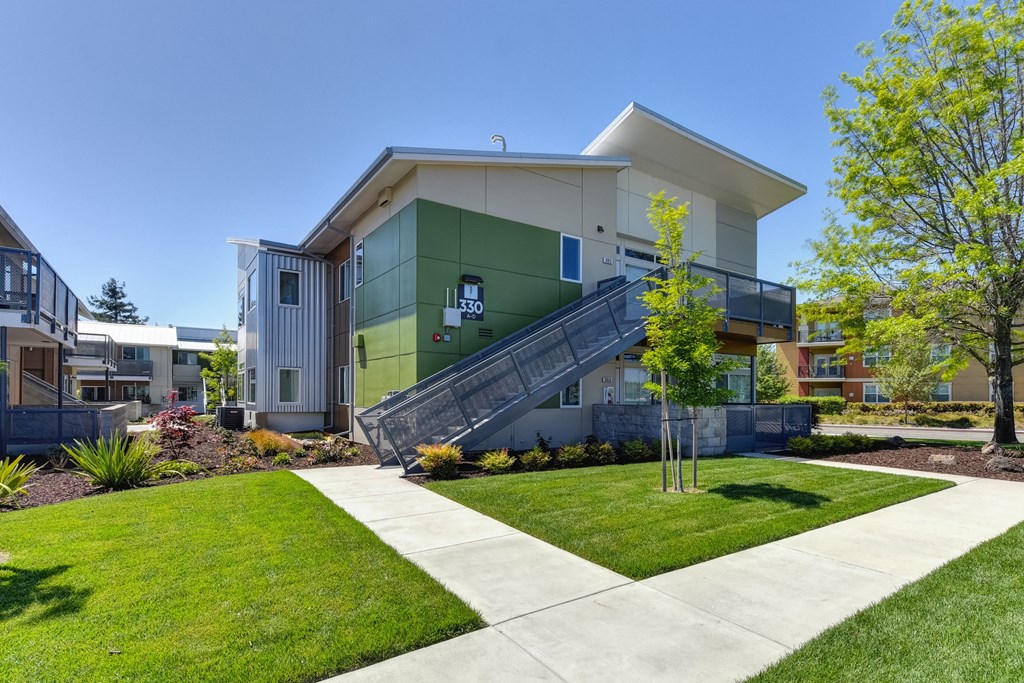 Apartment Exterior with Walking Path, Grass, Stairs and Trees at Addison Ranch Apartments, Petaluma, CA