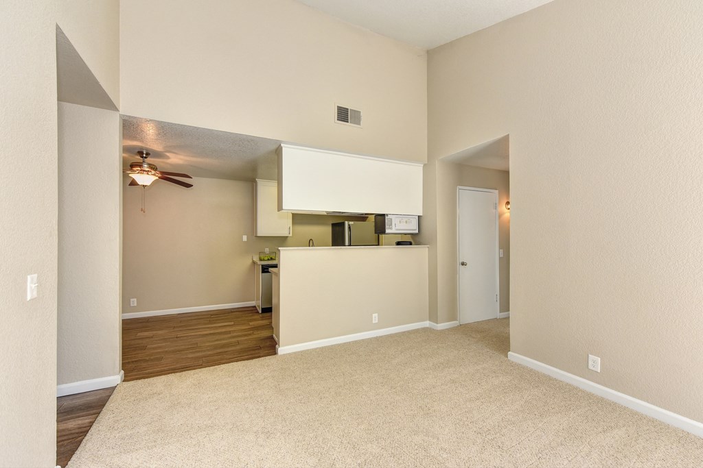 Empty Living Room with Carpet, View of Kitchen, Ceiling Fan/Light at Cobblestone Creek Apartments, California, 95661
