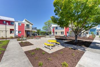 Outdoor Lounge Space Walking Path, Wood Chip Floor, Picnic Tables at Addison Ranch Apartments, Petaluma, CA