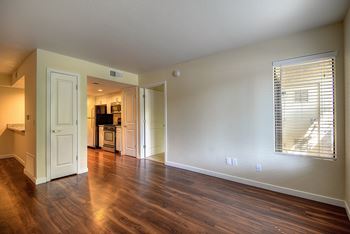 Two bedroom, two bath home that is vacant but showing the hardwood inspired flooring through out