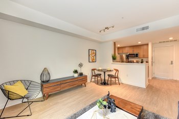 Living area with seating and hardwood inspired flooring,