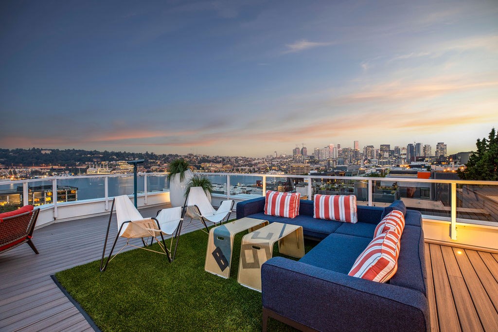 A patio with a view of the city at dusk. at The Summit at Lake Union, Seattle, 98109