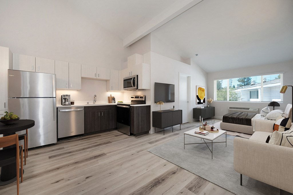 a living room with a couch and a table  at Track 281 Apartments, California