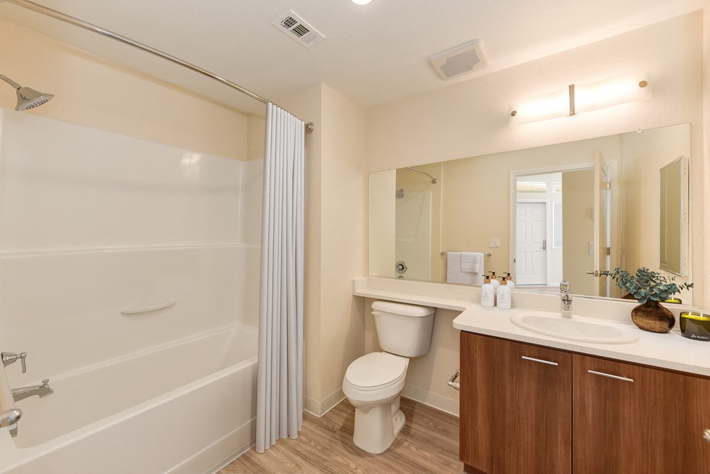 the preserve at ballantyne commons apartment bathroom with toilet sink and shower