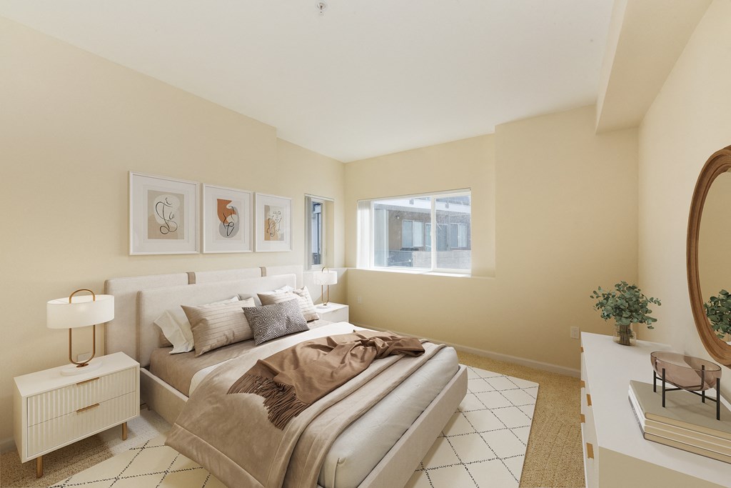 a bedroom with a large bed and a window