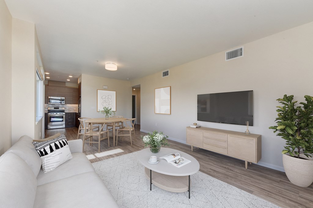 a living room with a couch and a table and a television