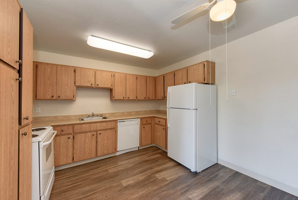 Kitchen Dining Area with Hardwood Inspired Wood Floors, Dishwasher, Refrigerator