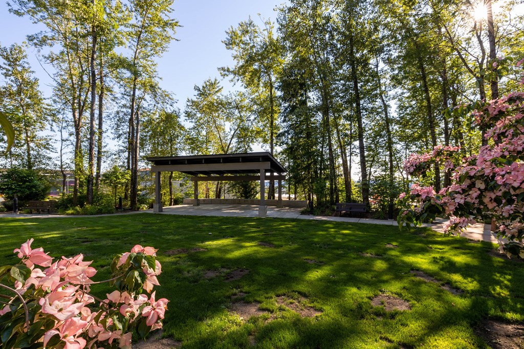 Avaya Ridge outside rest area with park-like setting including benches, Trees, Statues and grassy lawn.
