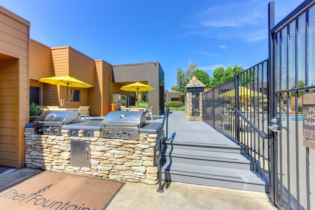 BBQ Area with Yellow Umbrellas, Grills, Gates with View of Pool at Fountains of Fair Oaks, Fair Oaks, 95628