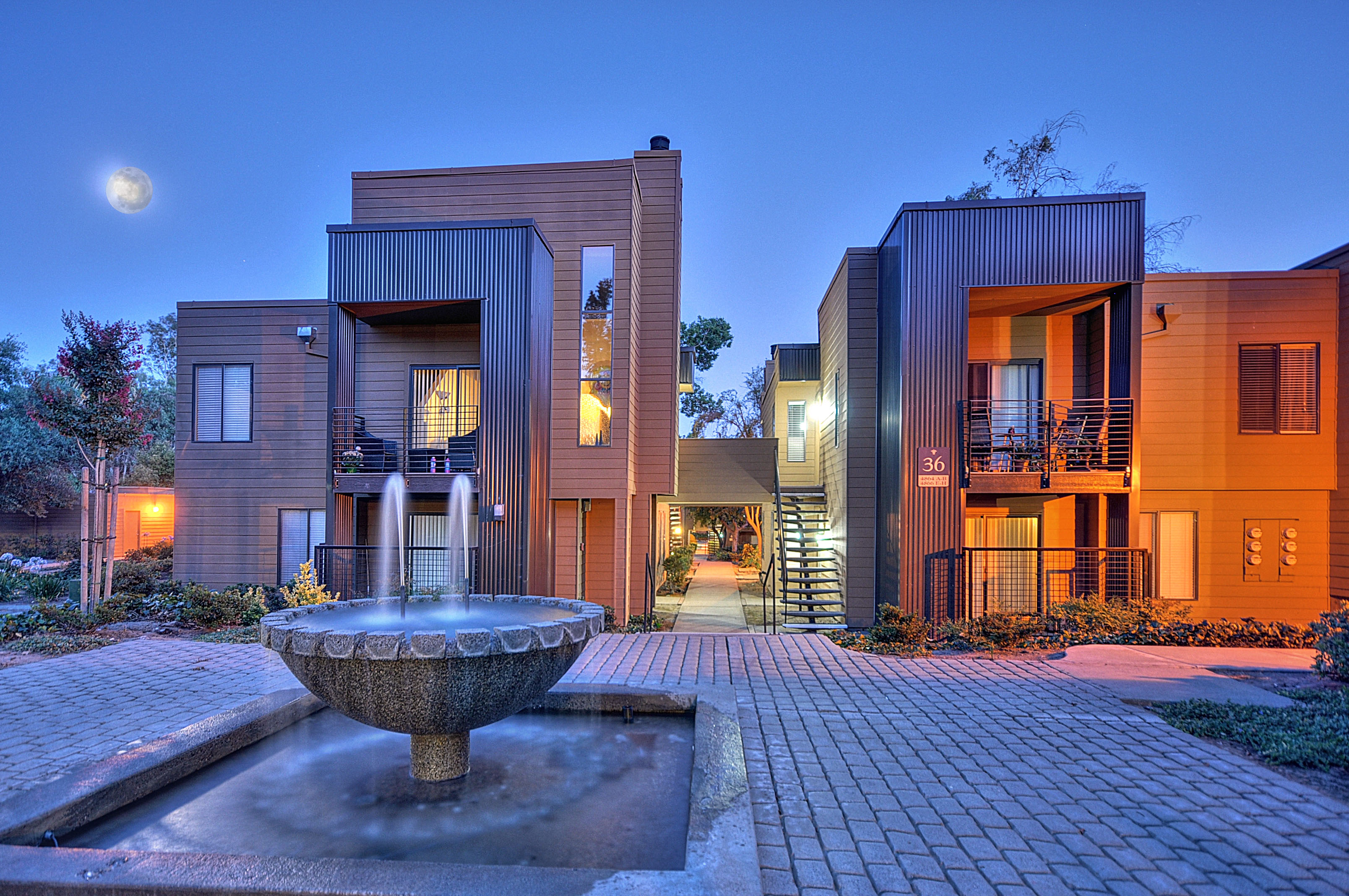 Community Outdoor Area with Stone Fountain, Stone Floor, and Full Moon at Fountains of Fair Oaks, California, 95628