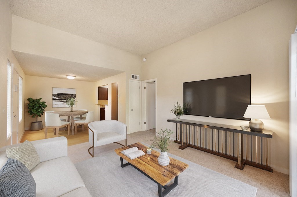 a living room with a couch and a television at Fountains of Fair Oaks, California