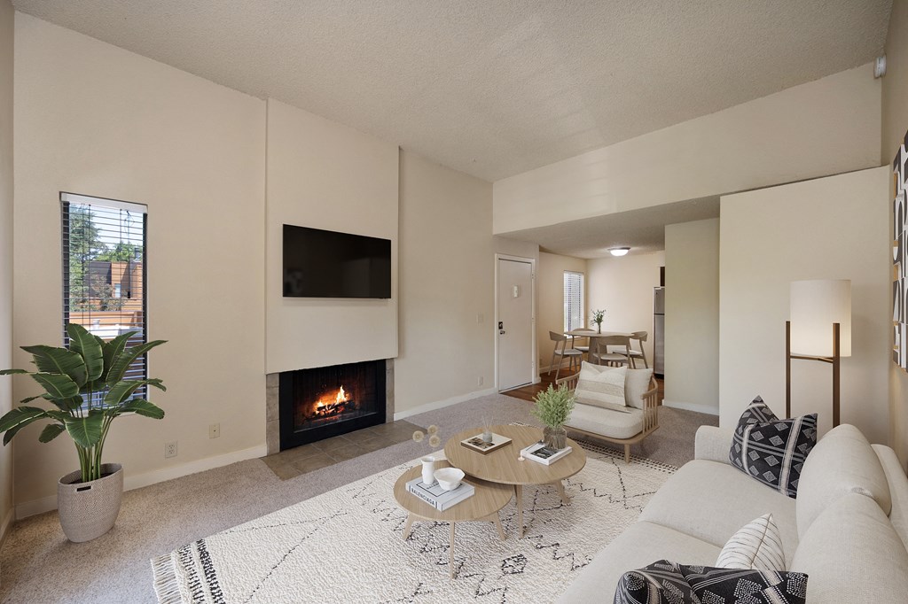 a living room with a fireplace and a couch at Fountains of Fair Oaks, California