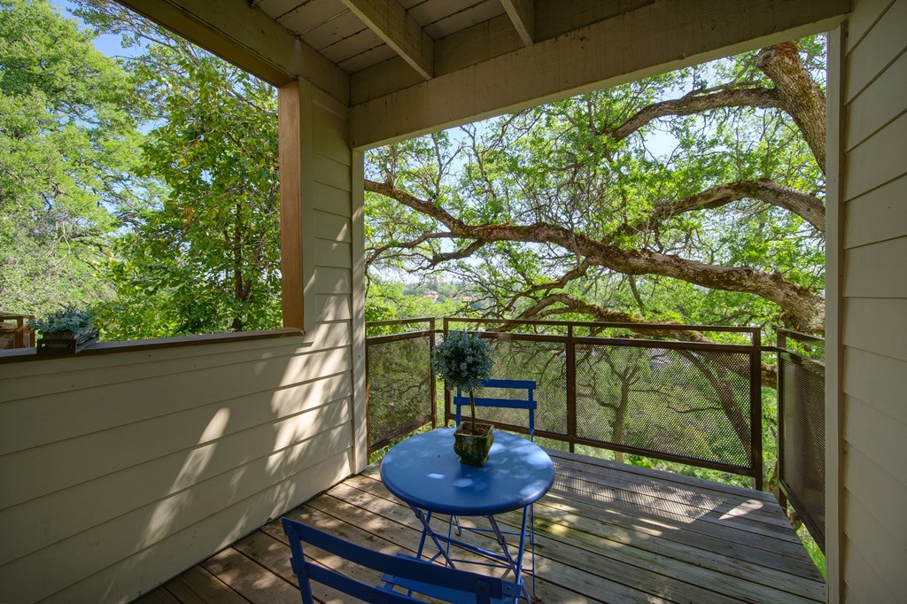 a covered patio with a blue table and chairs at Folsom Ranch Apartments in California at Folsom Ranch, Folsom, 95630
