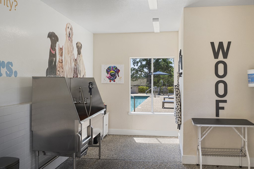 a room with a piano and a window with a pool in the background at Folsom Ranch, Folsom