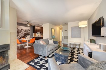 Entrance of the model home and the living room with views in the distance of the dining area and kitchen - Photo Gallery 4