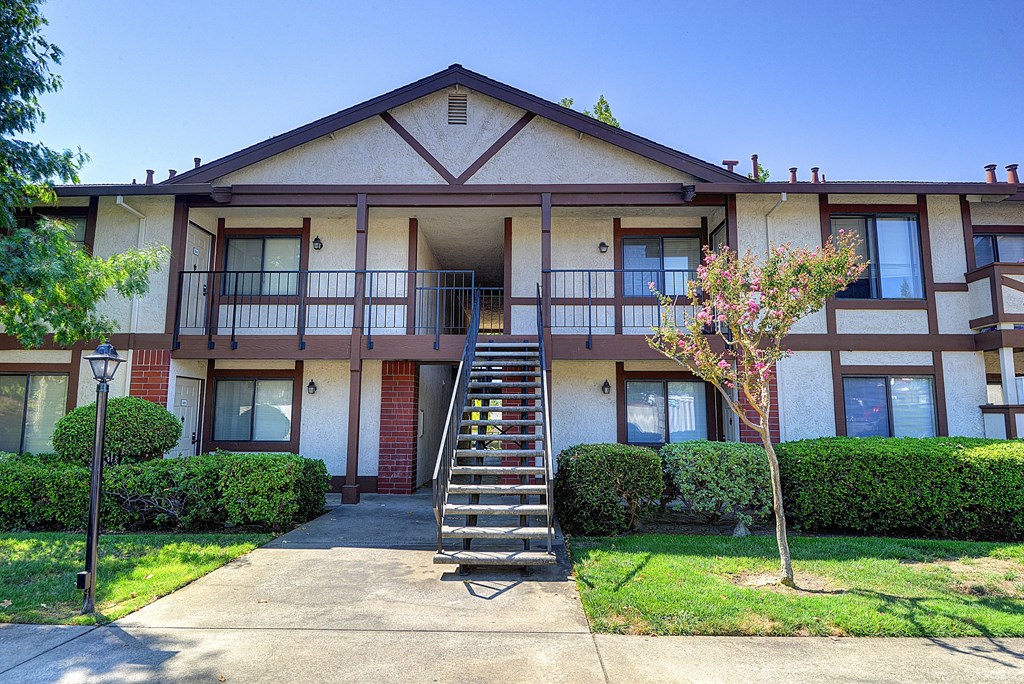Building Exterior with Grass, Walkway, Trees and Staircase
