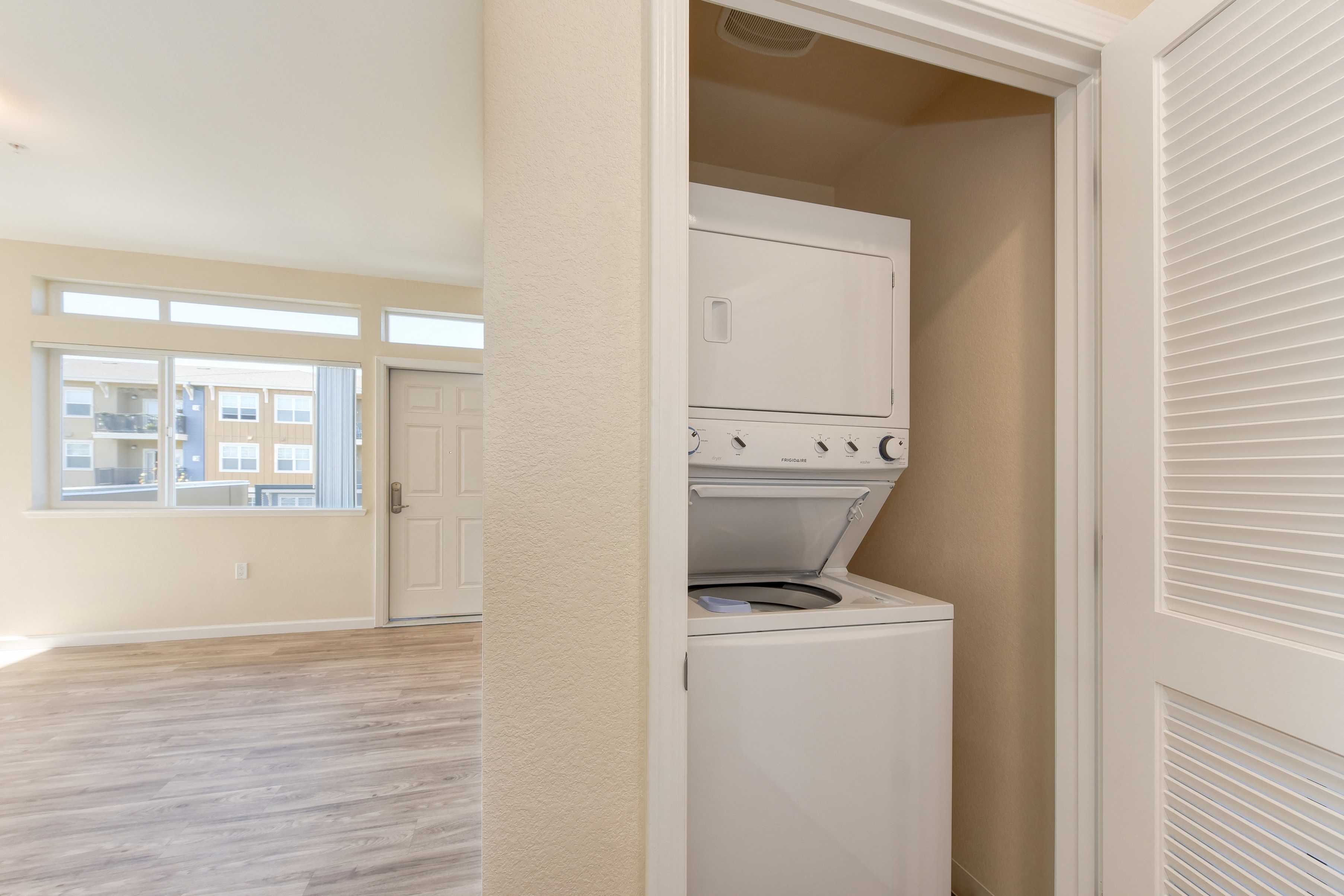 In Unit Washer/Drye, Hardwood Inspired Floors, View of Window at Addison Ranch Apartments, California, 94954