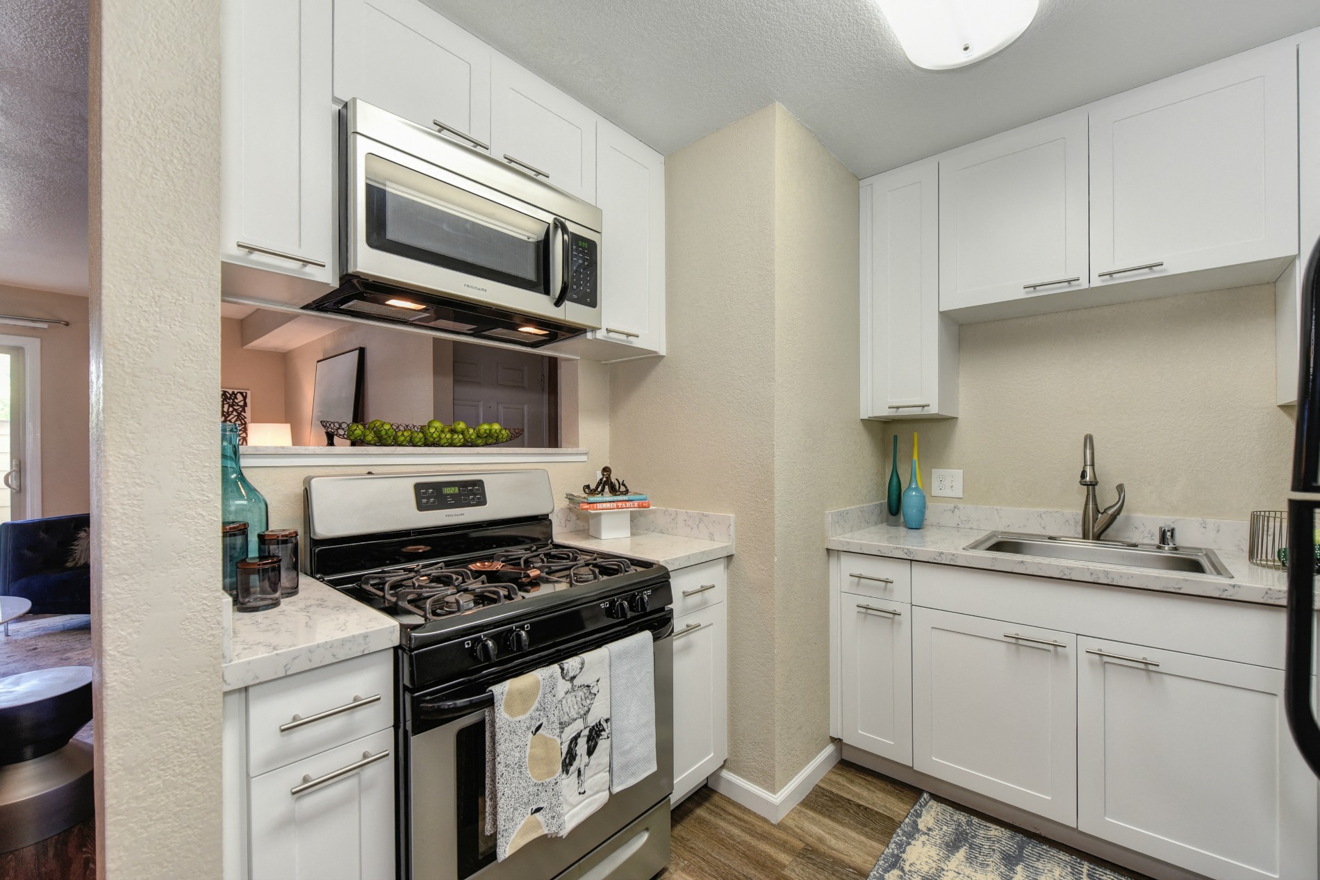 Kitchen with Stainless Steel Range Stove Oven Microwave Dishwasher and Refrigerator at Cobblestone Creek Apartments, California, 95661