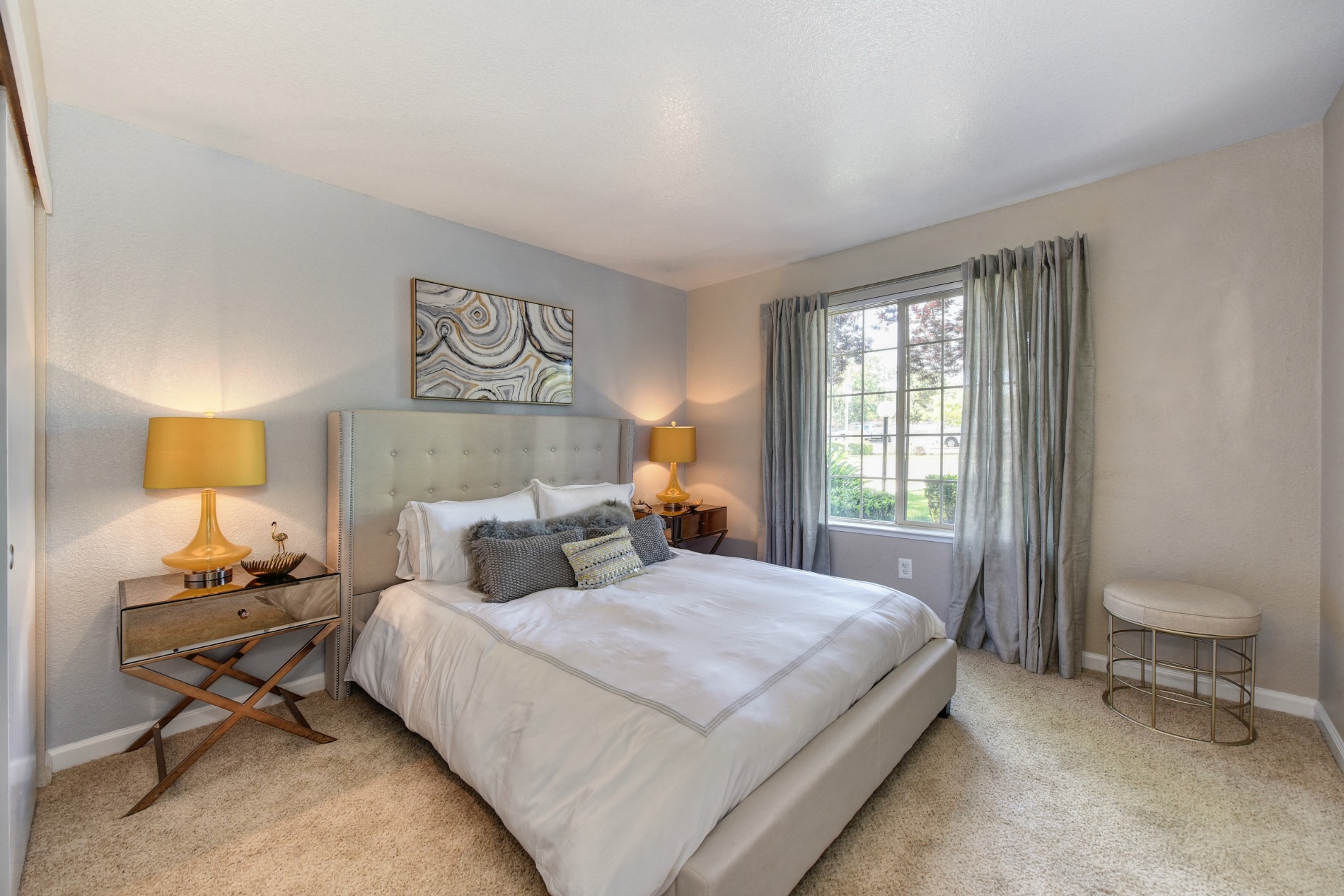 Bedroom with Window and Blue Curtains, Carpet, and  Lamps at Cobblestone Creek Apartments, Roseville, 95661,