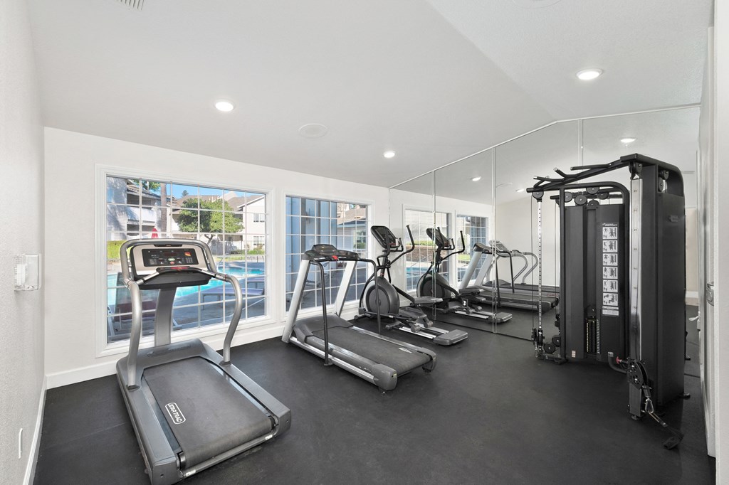 The on-site gym at The Legacy apartments is equipped with cardio machines and weights at The Legacy Apartments, California, 95843