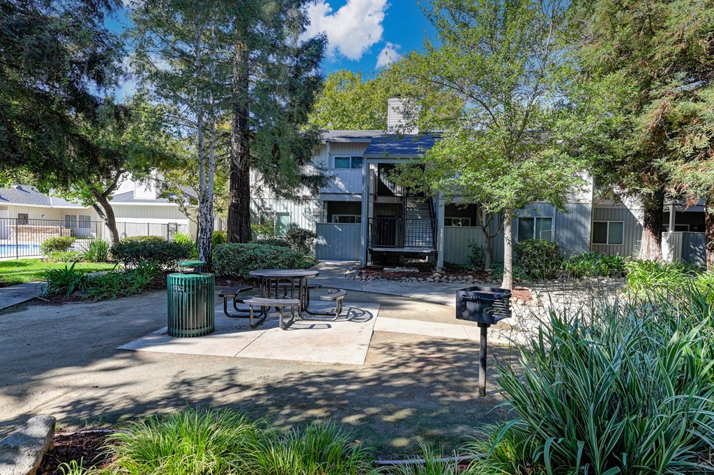 One of a few community picnic areas that have table, BBQ and trashcan . at Monte Bello Apartments, Sacramento, CA