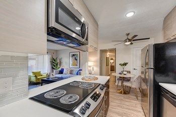 Kitchen Kitchen with Hardwood Inspired Floors, Stove Top, Microwave, and View of Dining Room - Photo Gallery 2