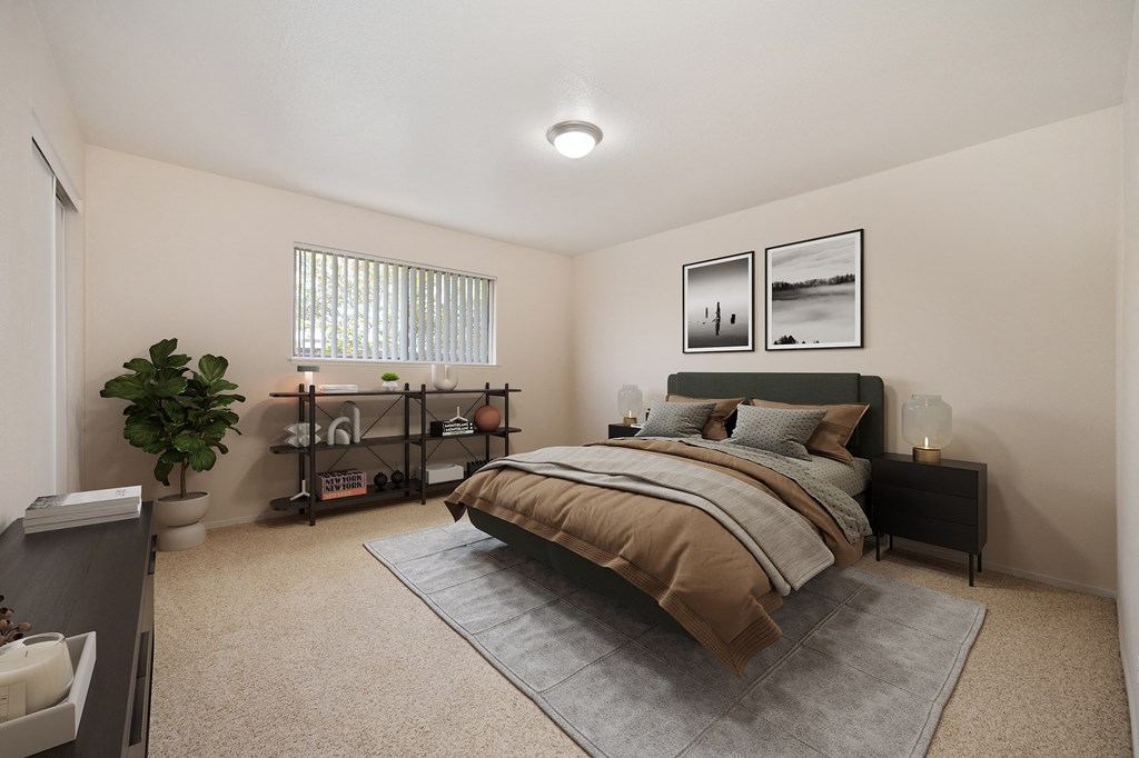 A bedroom with a bed, nightstand, and a plant.