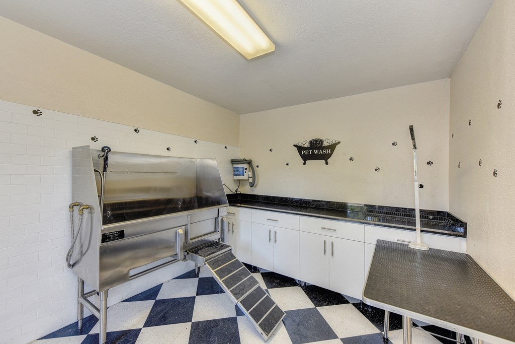 Pet Spa with dog Grooming Station with sink, Checker Patter Floor,and Table at Hidden Oaks Apartments, Citrus Heights, 95621