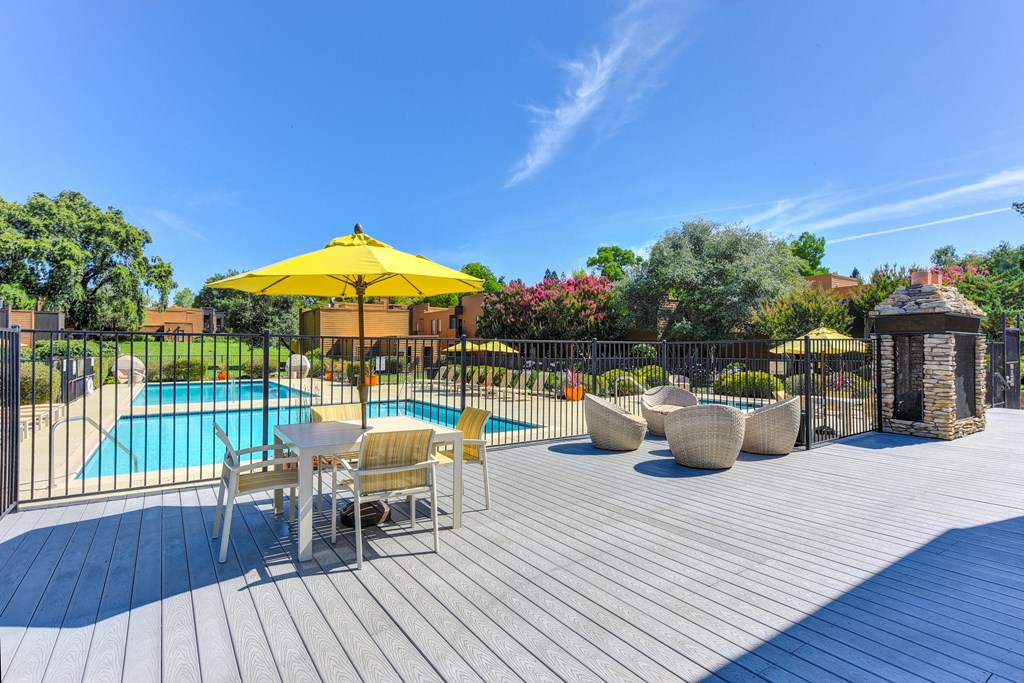 Pool Lounge  Area  with Yellow Umbrellas, Grills, Wicker Chairs, Gates with View of Pool at Fountains of Fair Oaks, Fair Oaks, CA