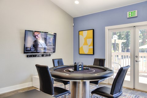 Community clubhouse with gaming table at Renaissance Park Apartments, California