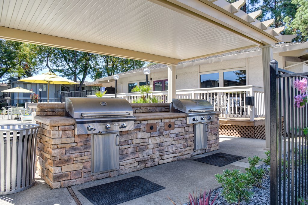 Community covered outdoor kitchen with two bbq grills at Renaissance Park Apartments, Davis, CA