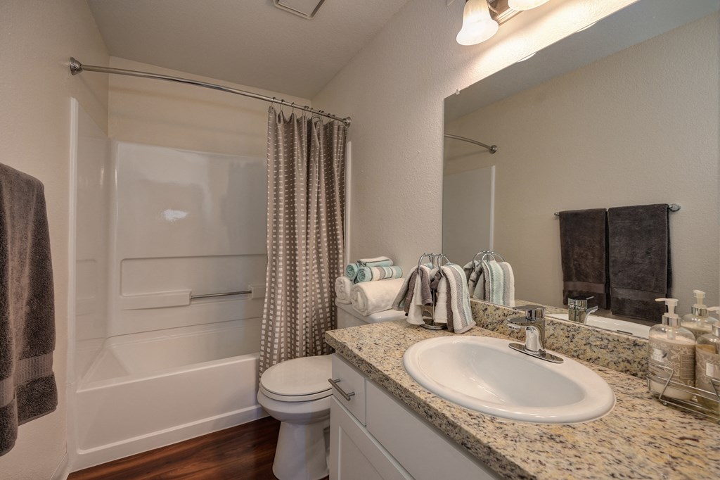 Bathroom with Sink, Toilet, Hardwood Inspired Floor and Bathtub at Rocklin Manor  Apartments, Rocklin  ,California, 95677